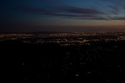 High angle view of illuminated buildings in city at night