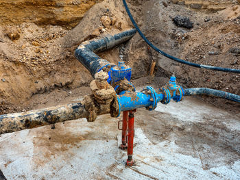 High angle view of rope tied on rusty metal