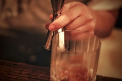Close-up of hand holding drink