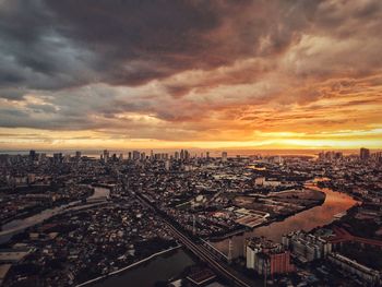 High angle view of city against sky during sunset