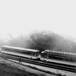 Train at railroad station against clear sky