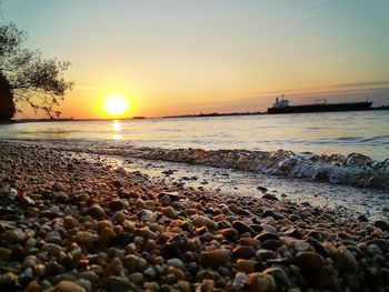 Scenic view of sea at sunset