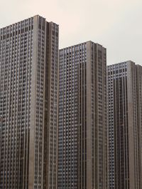 Low angle view of modern buildings against sky