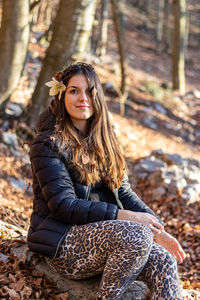 Young woman's portrait with white flower in her hair