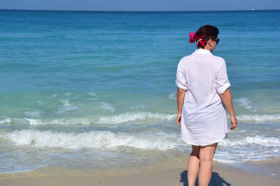 Full length of man standing on beach