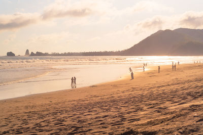 Scenic view of beach against sky during sunset