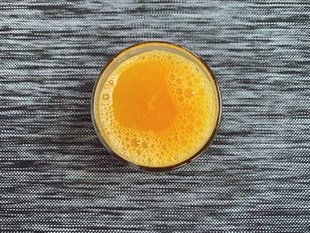 High angle view of orange juice on table