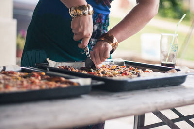 Midsection of woman preparing food