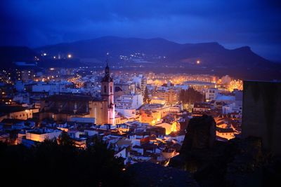 Illuminated cityscape at dusk