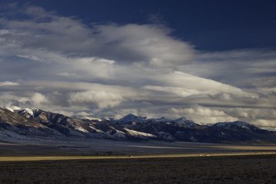 Scenic view of snowcapped mountains against sky