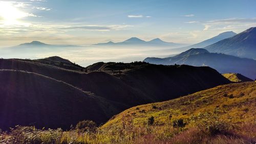 Scenic view of mountains against sky during sunrise