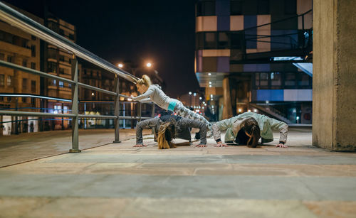 People walking on street at night