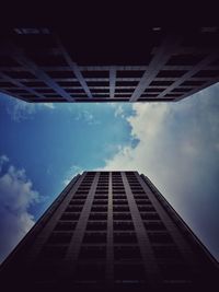 Low angle view of buildings against blue sky