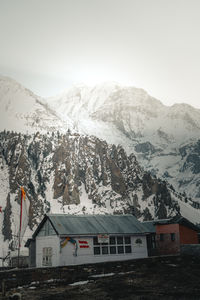 Scenic view of snowcapped mountains against clear sky