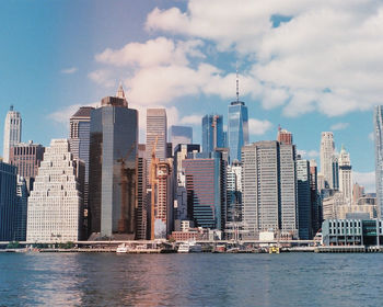 Modern buildings in city against sky