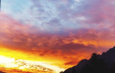 Low angle view of dramatic sky during sunset