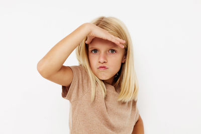 Young woman wearing hat against white background