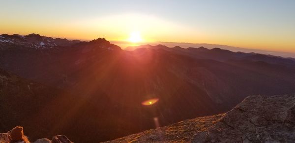 Scenic view of mountains against sky during sunset