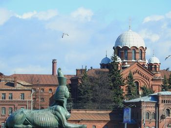 View of city against cloudy sky