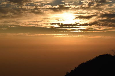 Scenic view of dramatic sky during sunset