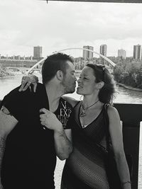 Young couple standing in city
