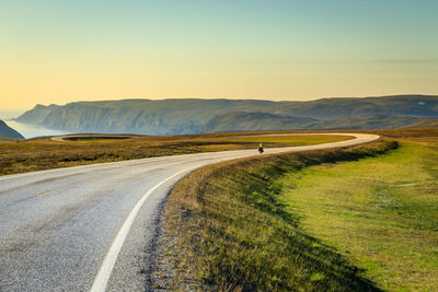 Mountain road against clear sky