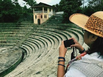 Woman photographing with mobile phone