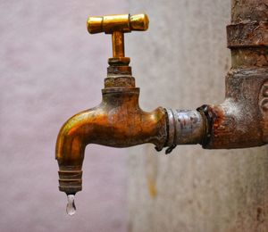 Close-up of water pipe against wall