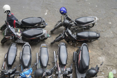 High angle view of motor scooters parked on street