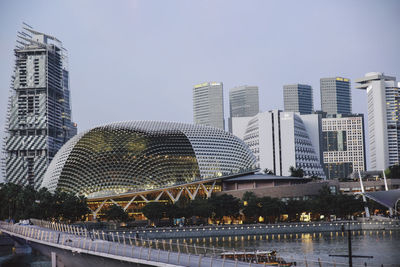 Esplanade theater in city by marina bay against sky