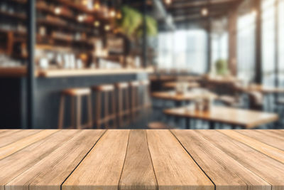 Close-up of wooden table in restaurant