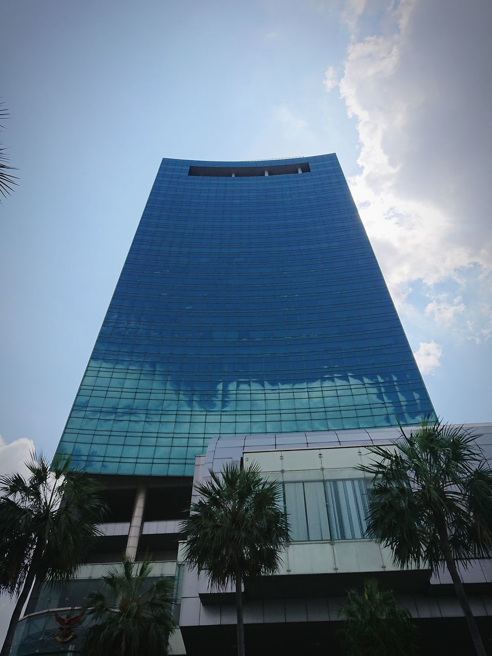 LOW ANGLE VIEW OF BUILDING AGAINST BLUE SKY