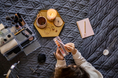 Midsection of woman using mobile phone