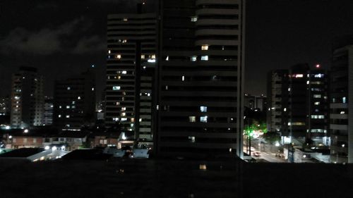 Modern buildings in city at night