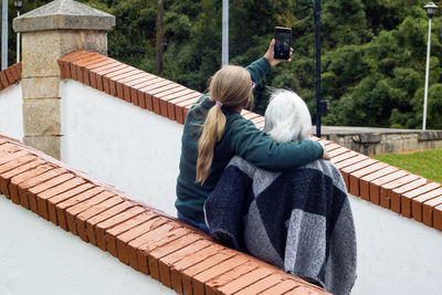 Group of women travelling. famous historic bridge of boyaca in colombia. colombian independence .