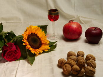 High angle view of fruit and flowers on table