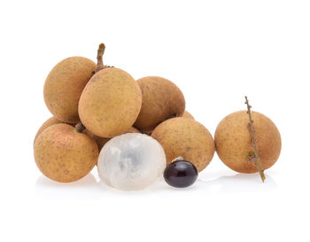 Close-up of longan against white background