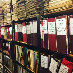 Graffiti on books in shelf