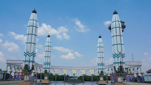 Low angle view of building against cloudy sky