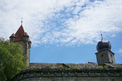 Low angle view of bell tower against sky