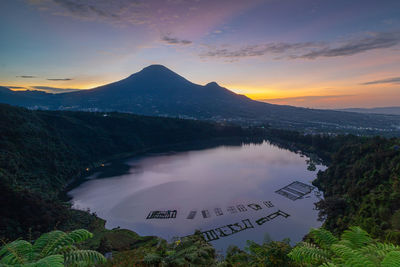 Menjer lake with sunrise and sindoro mount as background