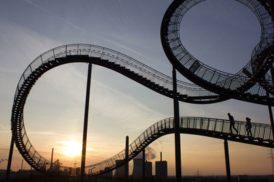 Low angle view of ferris wheel against sky