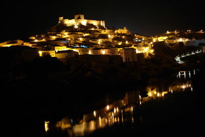 View of illuminated town at night