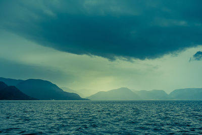 A beautiful view of the norway fjord from the sea level. 
