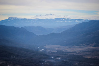 Snowy mountain peaks view, valley