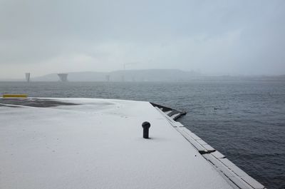 Pier over sea against sky
