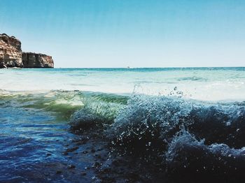 Scenic view of sea against clear blue sky