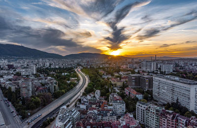 High angle view of buildings against sky during sunset