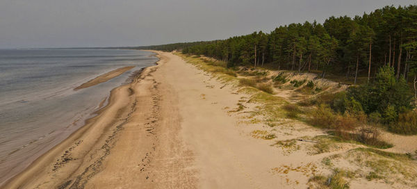 Scenic view of beach against clear sky