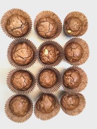 High angle view of cupcakes against white background